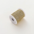 Detailed view of 1.8mm golden bead cable chain on white spool for jewelry making DIY - 1 Meter Pack (1.5mm Width / 2.3mm Bead) / 14K Gold