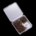 Macro detail of bronze earring hooks and silicone backs in a clear plastic storage box - Antique Red Copper