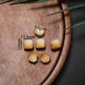 Detailed view of hand-carved Bodhi root beads in lion shape with size measurements - Awakened Lion Style Small