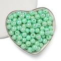Close-up of mint green acrylic beads with AB coating in a heart-shaped ceramic dish - 6mm (100 Pieces/Pack) / Lemon Green