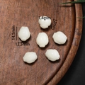 Macro view of lotus bud bodhi root beads with 1.4mm hole for DIY jewelry making - Style 24 White Ruyi (12.5*14.5mm)