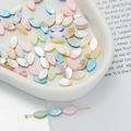 Macro detail of colorful marquise mother of pearl shell beads with iridescent gloss - Marquise Style (AC4106) / 1 Strand (approx. 40 pcs, 5.5x10.5mm)