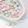 Macro view of teardrop mother of pearl beads in macaroon colors for DIY jewelry - Teardrop Style (AC4106) / 1 Strand (approx. 30 pcs, 9x13.5mm)