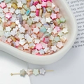 Macro shot of macaron colored floral beads with pearlescent finish for DIY jewelry - Small Flower Style (AC4106) / 1 Strand (approx. 65 pcs, 6.5x6.5mm)