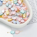 Macro shot of colorful shell beads in Hamsa Hand shape for DIY jewelry making and crafts - Hamsa Hand Style (AC4103) / 1 Strand (approx. 34 pcs, 8.5x12mm)