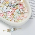 Macro detail of macaron colored star beads with iridescent pearl luster for DIY jewelry - Large Star Style (AC4104) / 1 Strand (approx. 57 pcs, 9x10mm)
