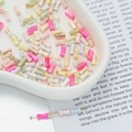 Close-up of colorful resin bow beads for DIY phone chains on a decorative tray - Bamboo Shaped Tube Bead Style 02 (AC4105) / 1 Strand (approx. 48 pcs, 4x8mm)