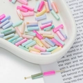 Macro shot of colorful cylindrical DIY beads with smooth marble texture in a ceramic tray - Cylindrical Tube Bead Style 04 (AC4105) / 1 Strand (approx. 36 pcs, 4x13mm)