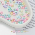 Macro detail of colorful pastel pearlescent oval beads for DIY jewelry making and phone chains - Oval Rice Shaped Bead Style 07 (AC4105) / 1 Strand (approx. 58 pcs, 4x7mm)