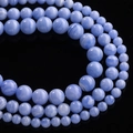 Macro shot of blue striped agate loose beads with natural white band patterns on black surface - Approx. 6.5mm (64 Pcs/Strand) / Purple Striped
