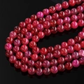 Macro view of deep red dragon vein agate beads with detailed cracked ice textures - Bright Red Dragon Vein Agate