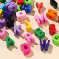 Macro shot of colorful acrylic alphabet beads with large holes for DIY jewelry making - S / 10 Pieces Pack / Random Mixed Colors