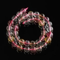 Macro detail of multicolored translucent quartz beads showing natural textures and gloss - 6.5MM / Rainbow Ghost