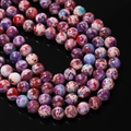 Macro detail of multicolored imperial stone beads with marble texture for DIY jewelry - 6.5mm (Approx 64 Beads) / Red Purple Green