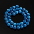 Macro shot of polished blue dragon vein agate round beads for jewelry making - 6.5mm (Approx. 57 Beads/Strand) / Apatite