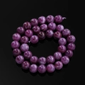 Macro shot of polished purple dragon vein agate beads with natural stone texture for DIY - 6.5mm (Approx. 57 Beads/Strand) / Sugilite