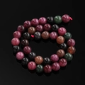 Macro detail of colorful dragon vein agate round beads with natural polished luster - 6.5mm (Approx. 57 Beads/Strand) / Black Tourmaline