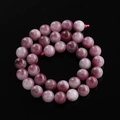 Detailopname van gepolijste roze paarse drakenader agaat kralen met natuurlijke textuur - 6,5 mm (ca. 57 kralen/streng) / Pruimenbloesem Toermalijn