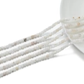 Macro view of 3mm faceted cube natural stone beads with translucent texture and sharp edges - White Moonstone