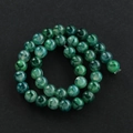 Macro detail of green agate dragon vein beads with natural mossy texture for DIY jewelry - 6mm (Approx 60 Pieces Per Strand) / Green