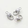 Macro view of three heart-shaped lobster clasps in polished silver finish for DIY jewelry - Heart Lobster Clasp / 5 Pieces/Pack (14*26.8mm) / Silver Polished Surface