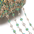 Macro detail of daisy flower and crystal bead chain on white plastic spool for DIY jewelry - Daisy Chain KC Blue (7.5x12.5mm)