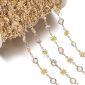 Detailed view of daisy and crystal gold chain on spool for DIY jewelry making - Daisy Chain KC White (7.5x12.5mm)