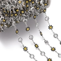 Detailed view of silver daisy chain with black enamel flowers and sparkling crystals - Daisy Chain White K Black (7.5x12.5mm)