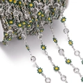 Macro shot of silver daisy chain with green enamel petals and clear crystal rhinestones - Daisy Chain White K Dark Green (7.5x12.5mm)