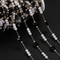 Close-up of DIY jewelry chain with black butterflies, white pearls and gold metal links - 1m / KC Gold Black