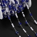 Detail of DIY jewelry chain with white faux pearls and blue butterfly beads on a spool - 1m / Silver Deep Blue