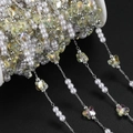 Macro shot of DIY chain with white pearls, silver beads and iridescent crystal butterflies - 1m / Silver Yellow