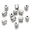 Macro shot of silver CCB plastic spacer beads with embossed patterns for DIY jewelry - Embossed Cylindrical (White K01) / 10pcs/Pack / Silver