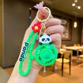Rotating panda keychain with green bamboo-shaped strap and fun decision spinner toy - Panda Spinner (Green Bamboo Shoot)