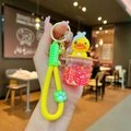 Luminous yellow duck keychain with floating red stars and a cute silicone handle - Luminous Transparent Red Cup Yellow Duck