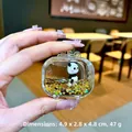 Detailansicht eines Panda-TV-Anhängers aus Acryl mit Goldsternen und Flüssigkeit - Ohne Schnalle Fernseher Stil / Schwarz Gold Panda
