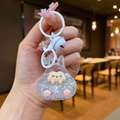 Close-up of a rabbit-shaped acrylic keychain with colorful holographic sequins and bell - Colorful Hardware Keychain Style / Luminous Burst Flashing Tata (White)