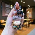 Macro detail of cartoon bunny girl liquid keychain with sparkling glitter and maple sequins - Color Hardware Style / Black
