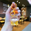 Detail of liquid quicksand rabbit keychain with golden glitter and orange ring - Color Hardware Style / Orange