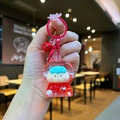 Détail du porte-clés astronaute rouge avec clochette et pendentif étoile scintillante - Style Mousqueton / Matériel Rouge Flash Lumineux Sœur Fruits