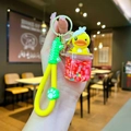 Luminous yellow duck bathtub keychain with red bead liquid and green silicone hand strap - Luminous Solid Red Cup Yellow Duck