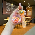 Close-up of Sakura themed keychain with pink beads, gold lobster clasp and silicone strap - Quicksand TV / Sakura Strap (Orange)