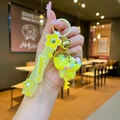 Detailed view of heart-shaped liquid glitter keychain with Sakura silicone strap - Sakura Strap-Yellow