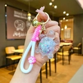 Detail von Schildkröten-Schlüsselanhänger mit Glitzersand und rosa Silikon-Handgelenkband - Pfoten-Seil Leuchtende Glitzernde Schildkröte / Weiß