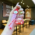 Macro shot of acrylic liquid keychain featuring a cute rabbit with pink silicone strap - Leather Strap Keychain Style / Luminous Burst Flashing Tata (Red)