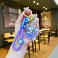 Detail of creative resin turtle keychain with purple strap and glitter oil sand design - Wristband Purple Quicksand Turtle
