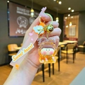 Detail of cartoon bear keychain with yellow resin doll and pink Sweet Heart strap - Leather Cord Style / Orange