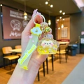 Detail of yellow liquid acrylic keychain with sequins, pearls and sweet heart strap - Yellow (With Strap)