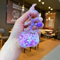 Détail du porte-clés violet à paillettes de neige avec sable liquide et clochette - Style Fermoir Mousqueton / Violet