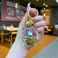 Detailed close-up of a panda panda keychain in a clock-shaped bottle with floating glitter - Lobster Clasp Style / Gold Hardware Alarm Clock Black Gold Panda